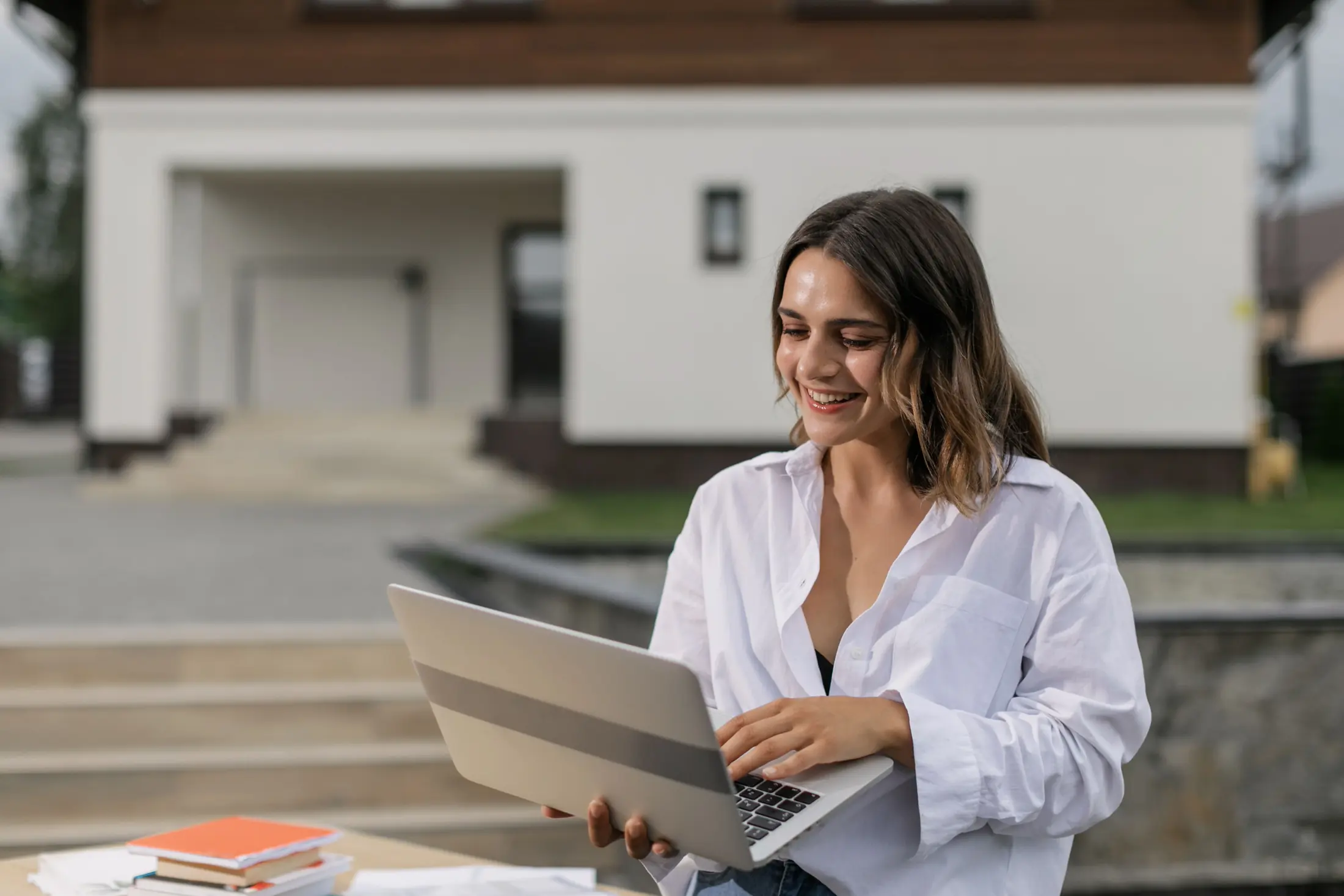Confident professional woman using a laptop after CISI exam success
